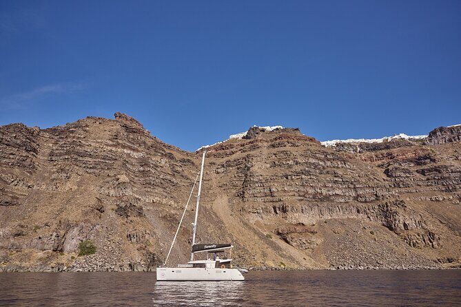 Santorini Oia: Luxury Sunset Cruise with Fresh Fish BBQ & Drinks - Santorini’s volcanic waters: sulfur springs and Nea Kameni