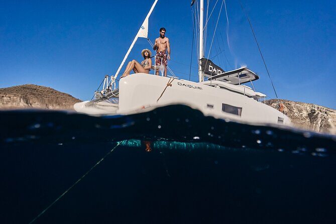 Santorini Oia: Luxury Sunset Cruise with Fresh Fish BBQ & Drinks - Mesa Pigadia and the lighthouse: sea views you can’t fake