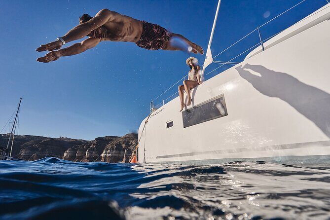 Santorini Oia: Luxury Sunset Cruise with Fresh Fish BBQ & Drinks - Red Beach, White Beach colors, and the big photo moment