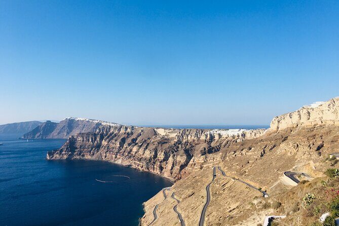 Santorini Panoramic Tour - Stop 2: Firostefani’s blue dome and the caldera balcony frame