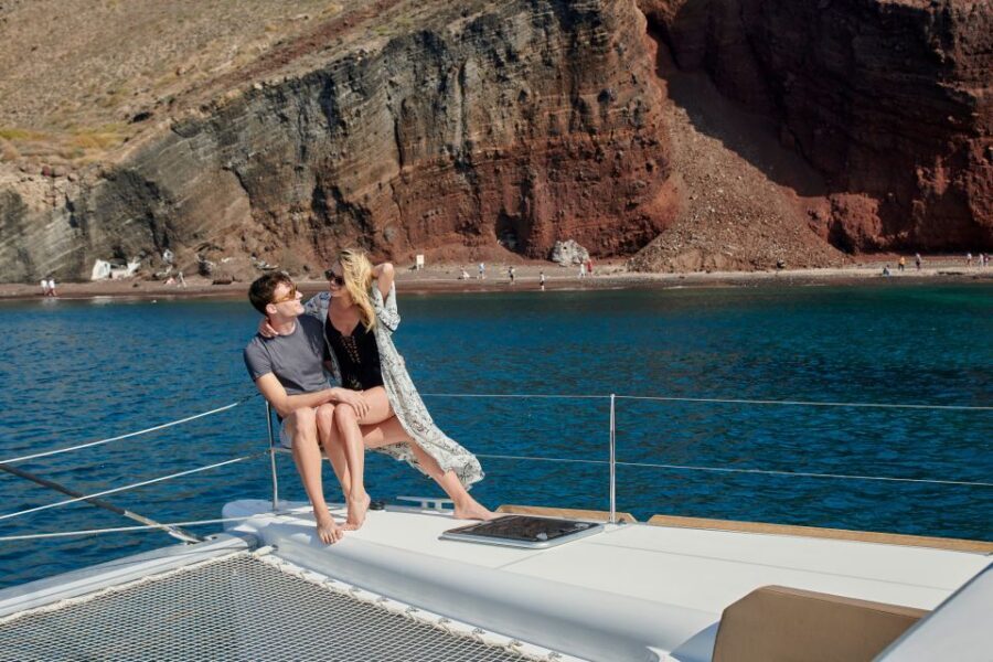 Santorini: Platinum Catamaran Cruise w/ BBQ Meal & Open Bar - Akrotíri Lighthouse sunset: seeing the famous moment without the worst crowds