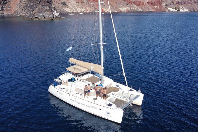 Santorini Platinum Catamaran Cruise with Meal, BBQ and Open Bar - Red Beach Stop: The Color Show and Quick Crew Facts