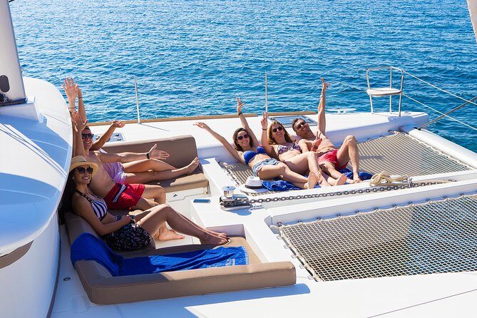 Santorini Private Catamaran Cruise with BBQ, Open Bar & Transfers - White Beach by boat-only access: swimming and snorkeling time