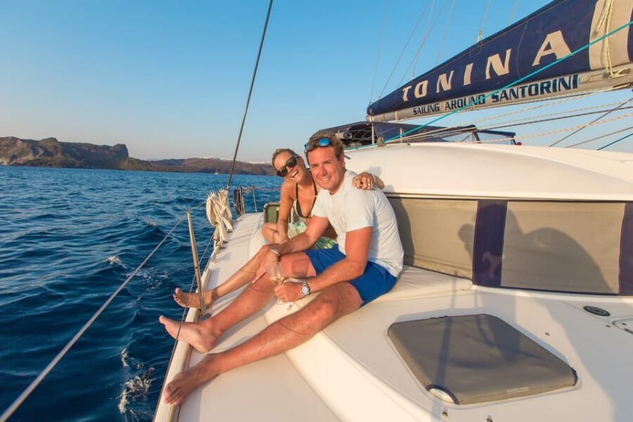 Santorini: Private Catamaran Cruise with Food & Drinks - Akrotiri Lighthouse, Indian Rock, and the Best Caldera Angles from Sea-Level