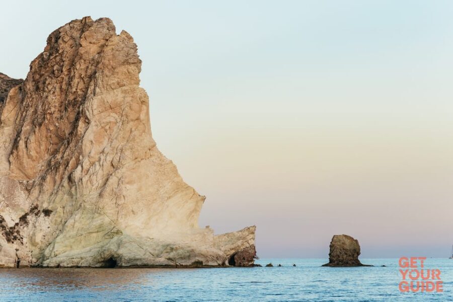 Santorini: Private Catamaran Tour with BBQ Meal and Drinks - Mesa Pigadia swimming and snorkeling: black formations and hidden-cave vibes
