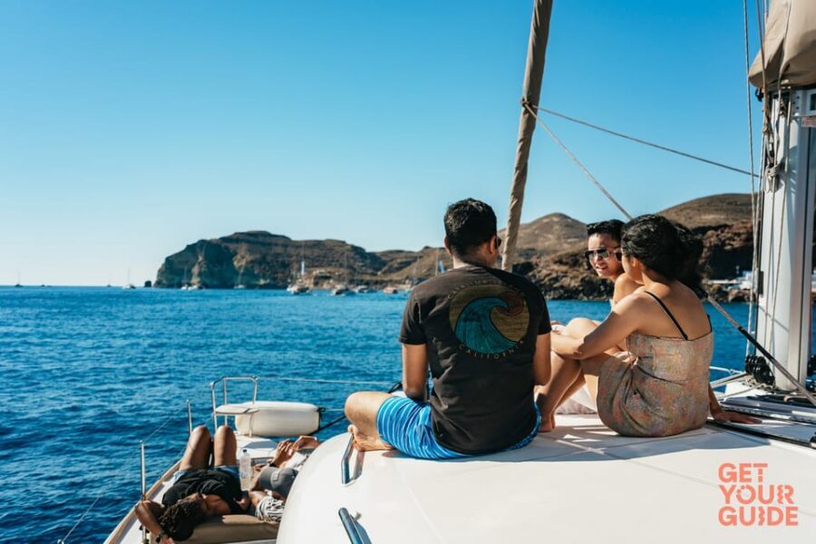 Santorini: Private Catamaran Tour with BBQ Meal and Drinks - Indian Rocks and the Venetian Lighthouse: classic caldera framing