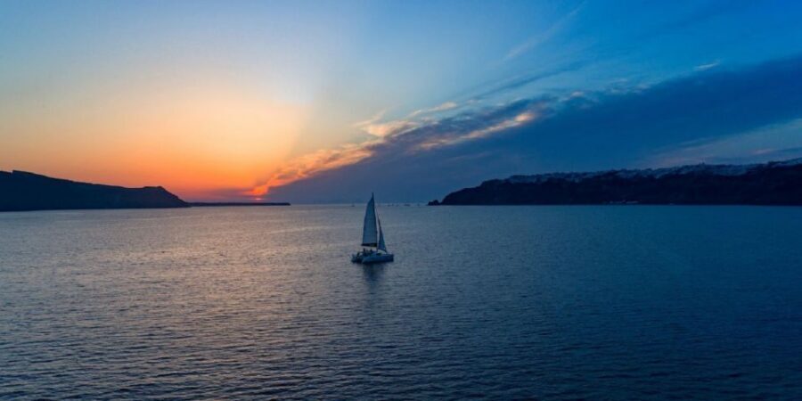Santorini: Private Sunset Cruise with Dinner and Drinks - Hot springs and volcanic islands snorkeling: the therapeutic stop
