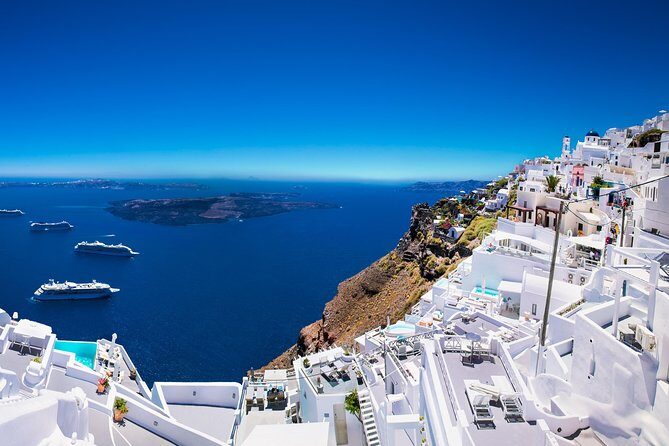 Santorini Private Tour 5hours Wine and local product tasting - Fira stop (20 minutes): cliffside photos and blue-domed churches