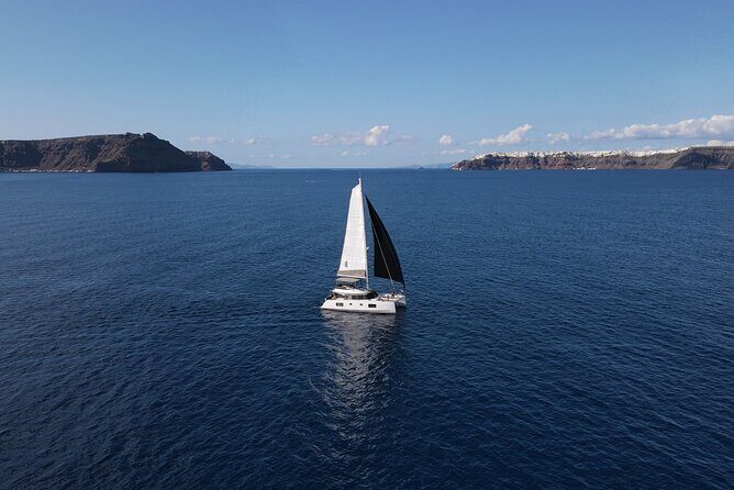 Santorini Private Tour Half-Day Sailing Platinum Catamaran Cruise - White Beach: a quieter contrast with pumice and stillness