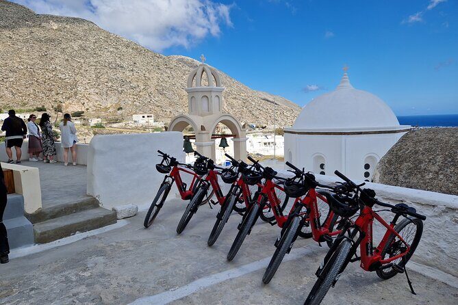 Santorini Small Group Guided E-bike Tour & Local Tomato Museum - Perissa Black Sand Beach is a quick taste of real coastal Santorini