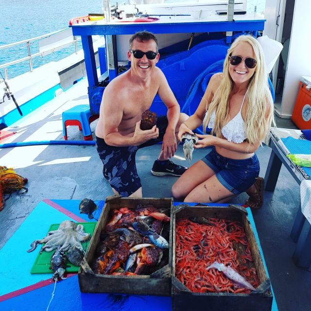 Santorini Sunset Fishing Trip with Dinner and Drinks - Swim and snorkel stop: what you get out of the Aegean Sea break