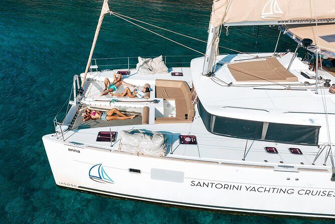 Santorini Sunset Sailing Cruise: Dinner, BBQ, Open Bar, Transfers - The sailing highlights: White Beach, Indian Rocks, and a Venetian Lighthouse view