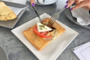 Santorini Sunset Walking Tour inc. tastings and 5 drinks - Three Bells of Fira and the Blue-Domed Church Photo Moment
