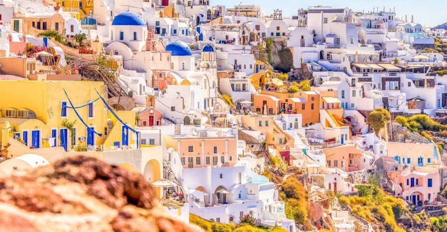 Santorini: Top Sights Day Trip, Wine Tasting, & Oia Sunset - Pyrgos Kallistis: winding alleys, castle views, and fewer crowds