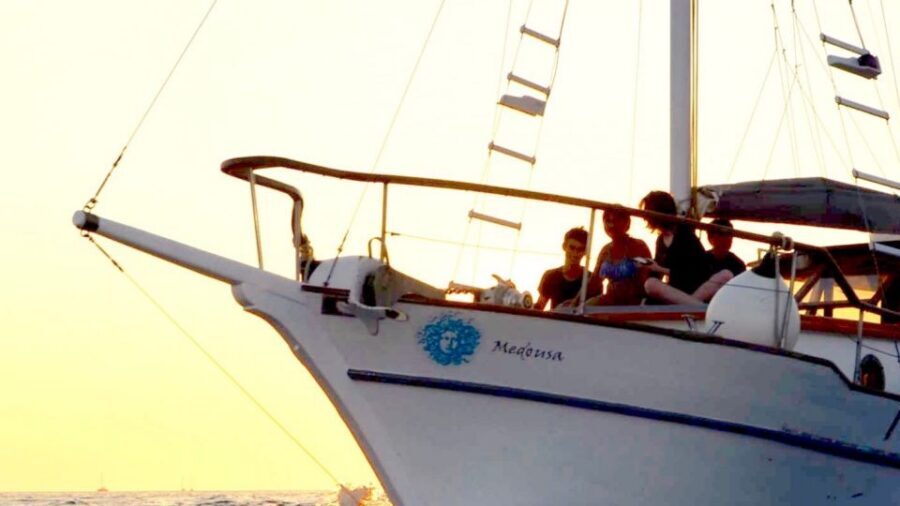 Santorini: Traditional Wooden Boat Tour with Meal and Wine - Entering the Santorini caldera from Vlychada