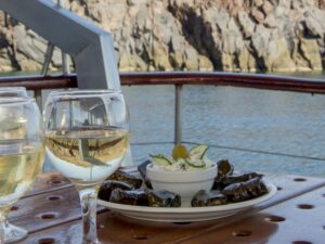 Santorini: Traditional Wooden Boat Tour with Meal and Wine - The Red Beach and White Beach photo-and-swim moments