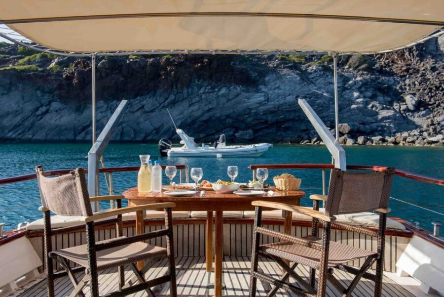 Santorini: Traditional Wooden Boat Tour with Meal and Wine - Ammoudi old harbour finish, plus the optional sunset route