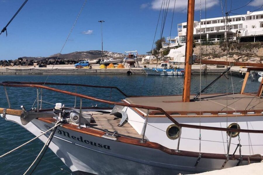 Santorini: Traditional Wooden Boat Tour with Meal and Wine - Boat, crew, and sea conditions: what you can control