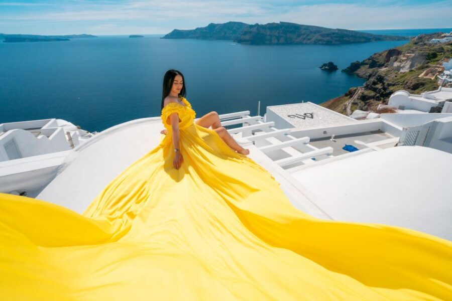 Santorini: Unique Flying Dress Photoshoot Experience - Oia photo stop: getting the iconic blue-domed church look