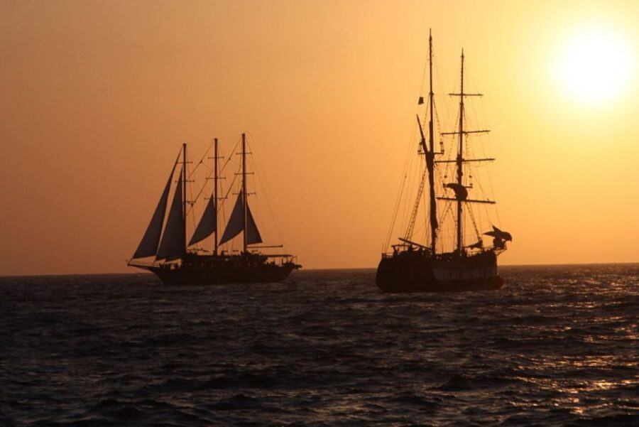 Santorini: Volcanic Sunset Cruise with Dinner - Food on Board vs Dinner at Captain John’s Taverna