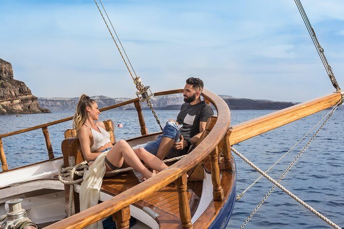 Santorini Volcano and Hot Springs Cruise Tour from Fira Old Port - Palea Kameni hot springs: warm water, orange tones, and a real swim