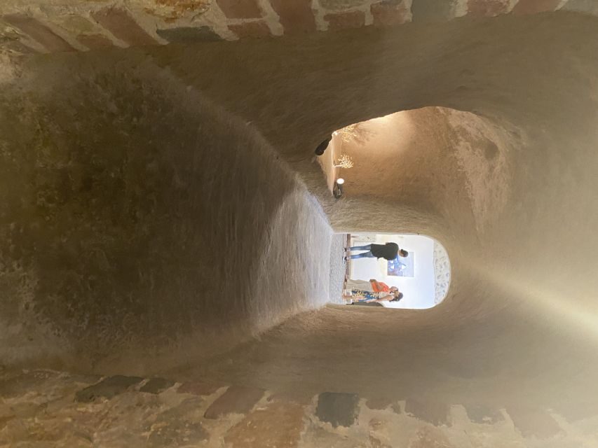 Santorini: Wine Tasting and Cave Settlement Tour - The winery stop: vineyards, production areas, and skip-the-line ease
