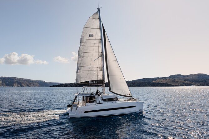 Shared Catamaran Half Day Cruise in Santorini - Stop 1: Athinios Port and the First 30 Minutes on the Move