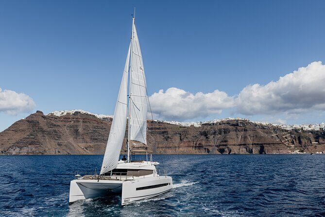 Shared Catamaran Half Day Cruise in Santorini - The Akrotiri Lighthouse Area: Old Stone, Sea Wind, No Rush